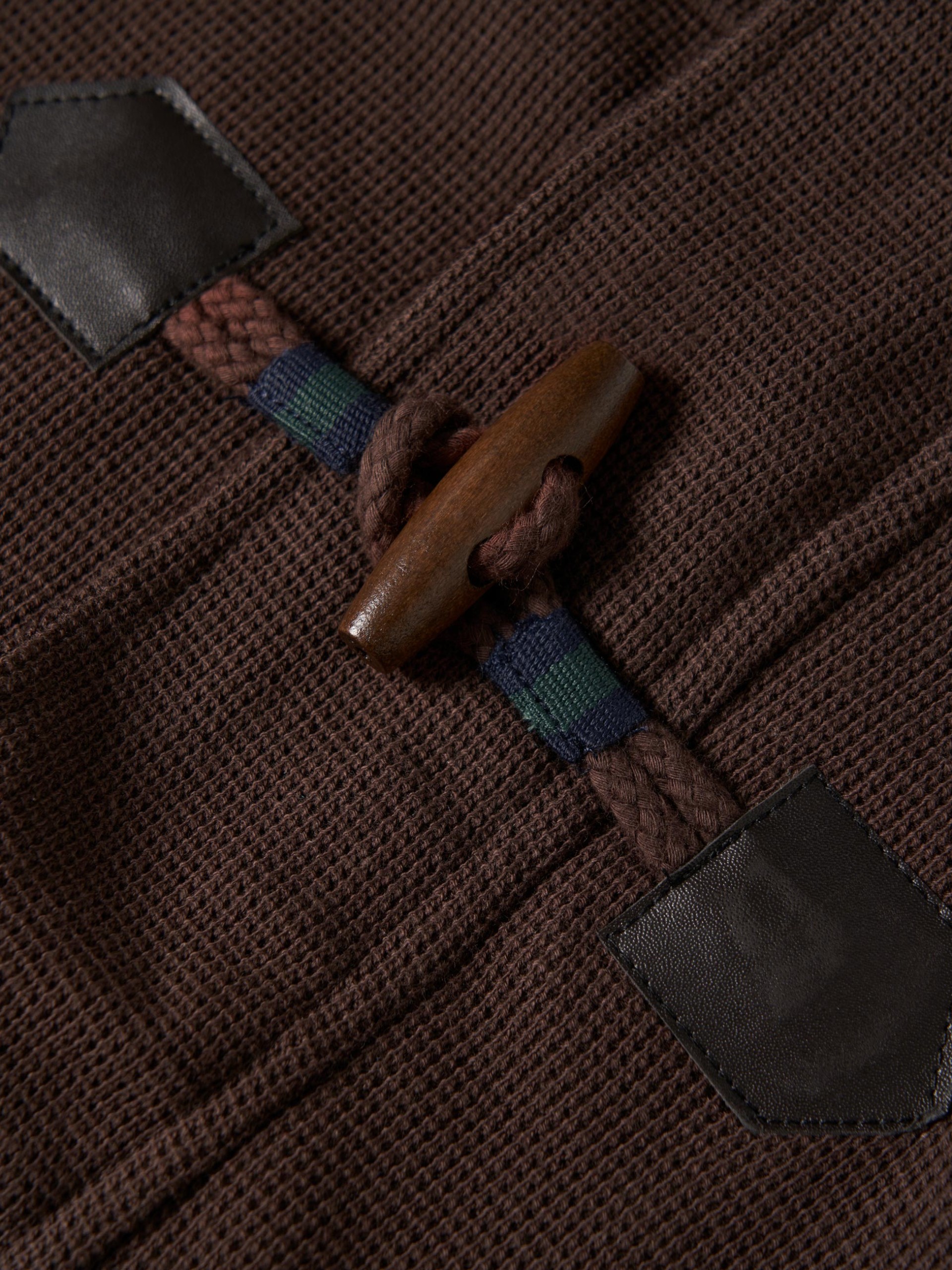 Abrigo de felpa con alamares