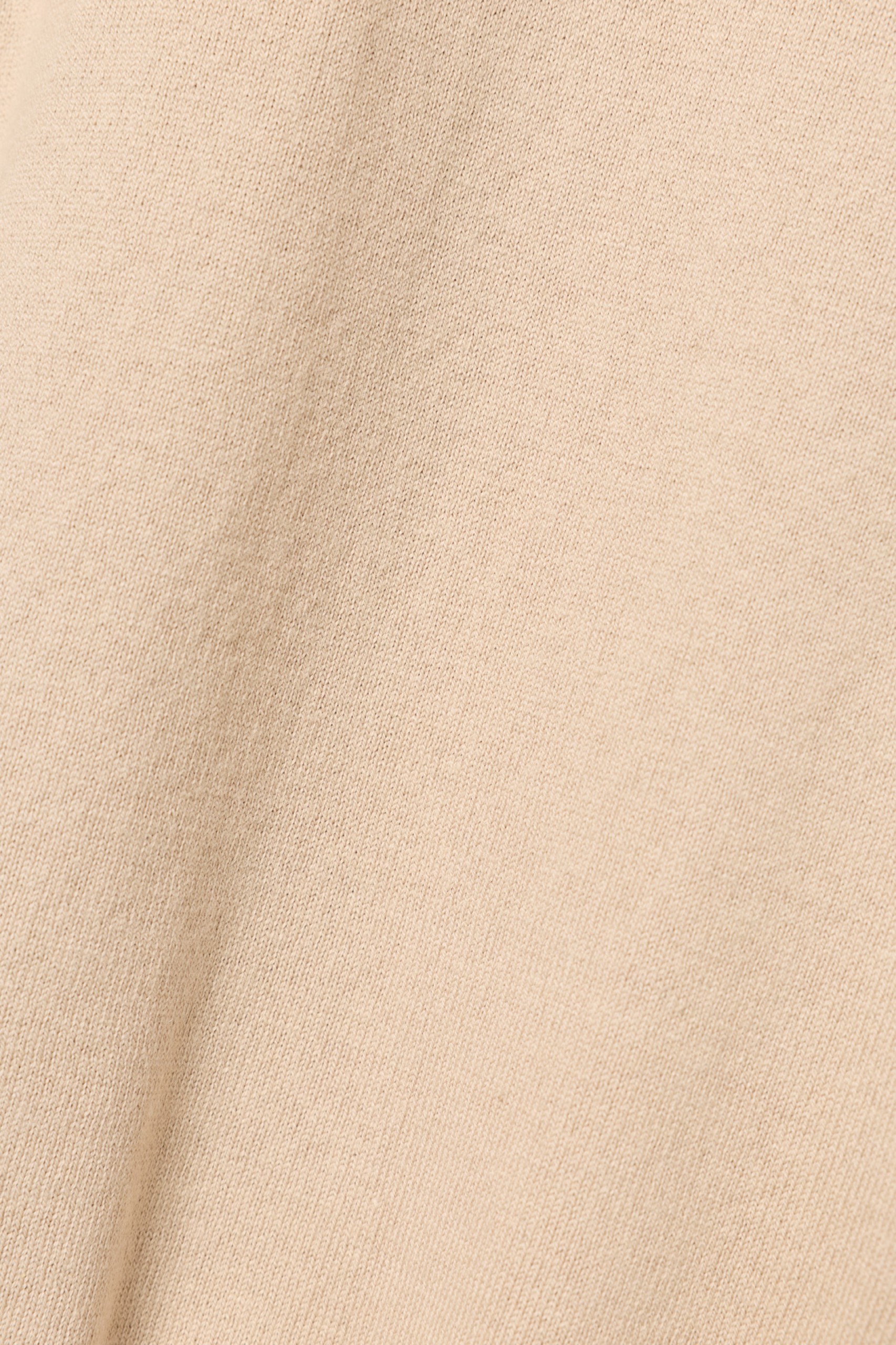 Jersey de cuello alto beige con cremallera
