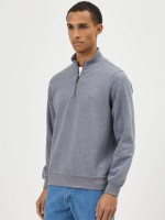 Jersey gris con cremallera y cuello