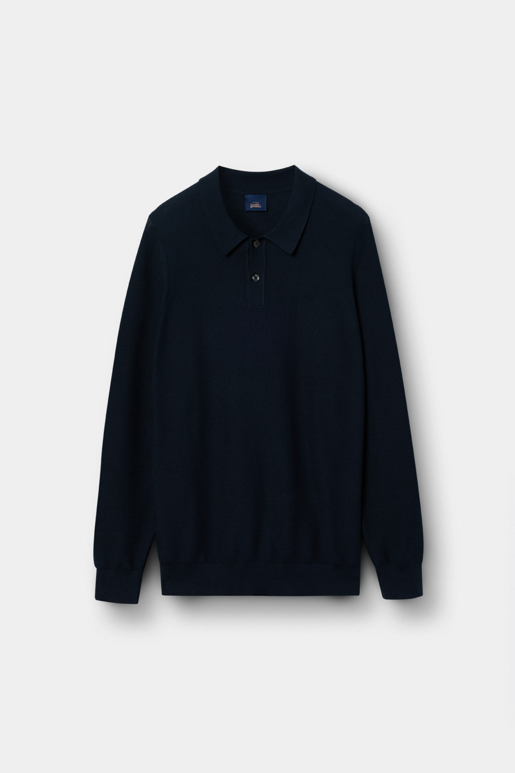 Polo de punto azul marino